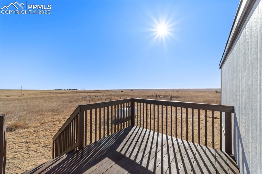 35275 Book Road Yoder, CO 80864 - Photo 27 of 30 a view of balcony with wooden floor