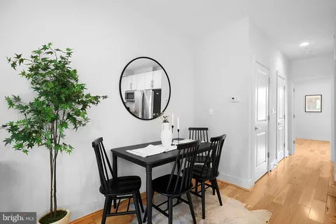 a bedroom with a bed and a wooden floor