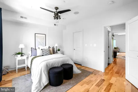 a bedroom with a large bed and a window