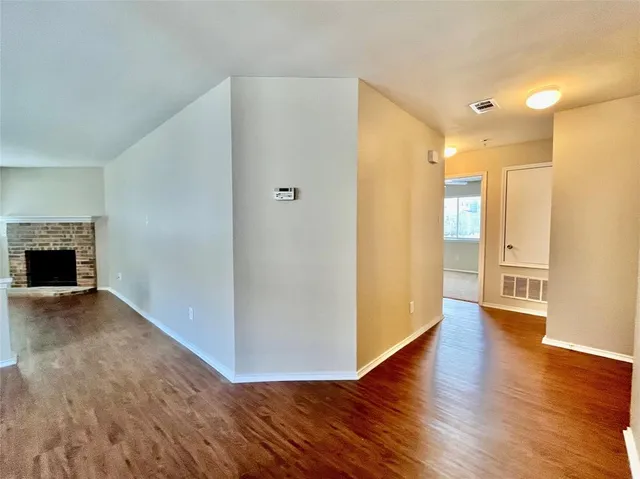 a view of a livingroom with wooden floor