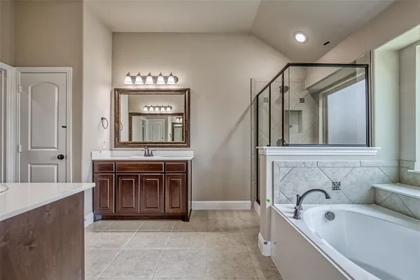 a bathroom with a shower and a bathtub