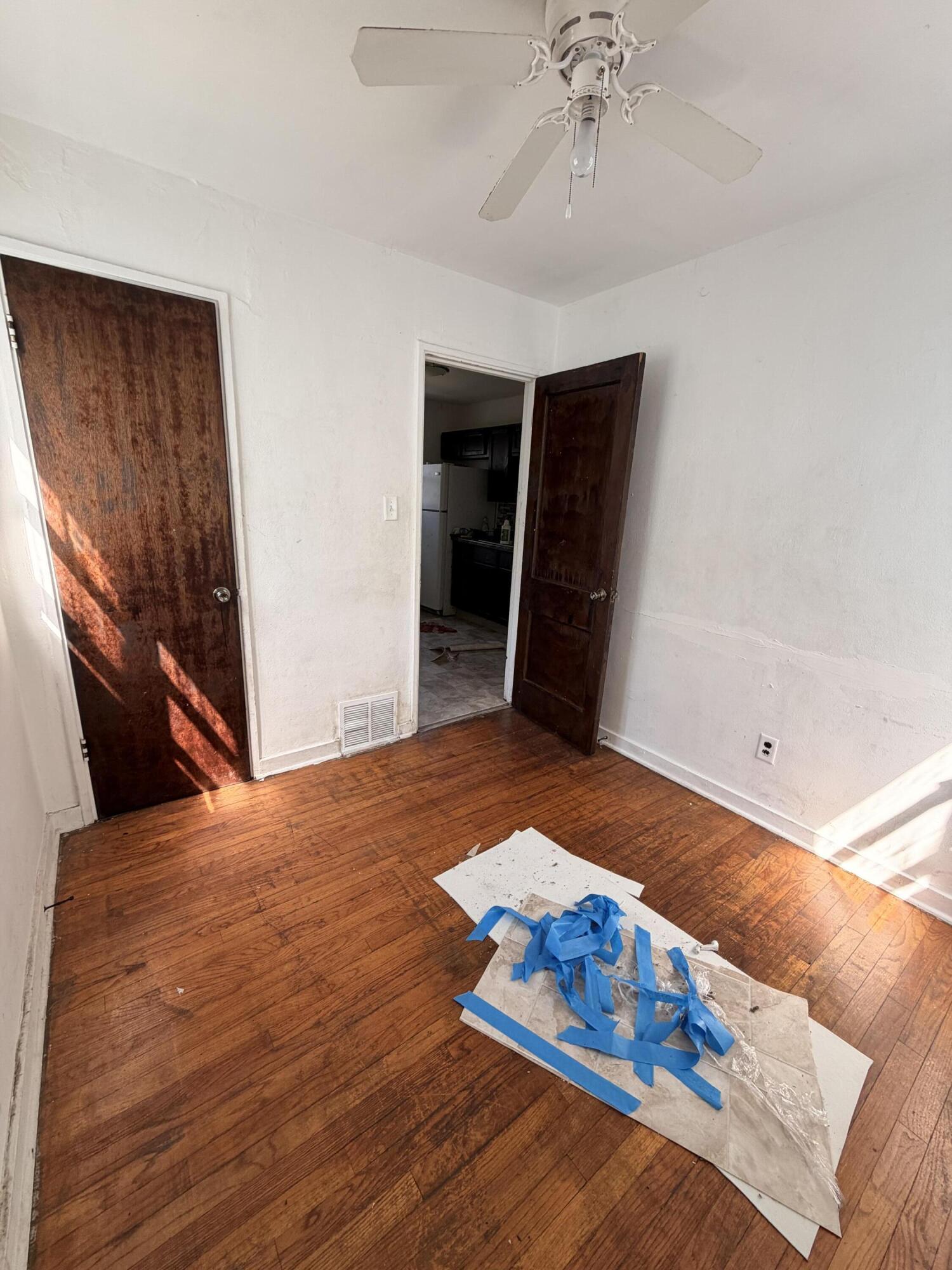 1724 Fillmore Street Gary, IN 46407 - Photo 5 of 8 a bedroom with a bed and a chandelier