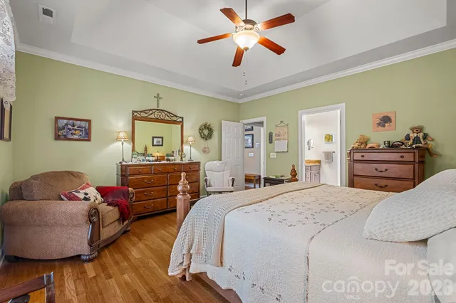 a bedroom with a bed and dresser