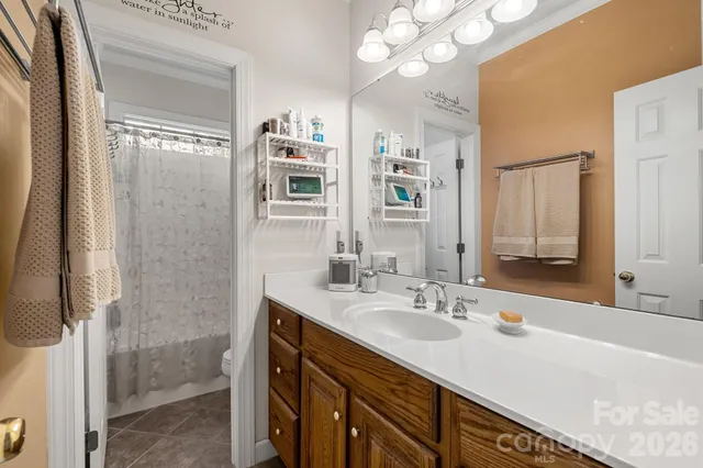 a bathroom with a sink double vanity and a mirror