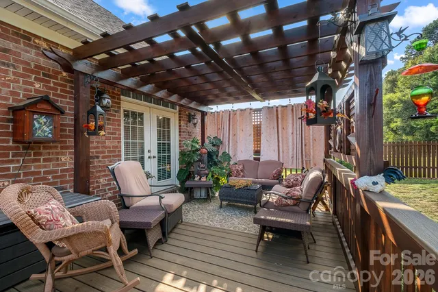 a patio with patio couch and wooden floor
