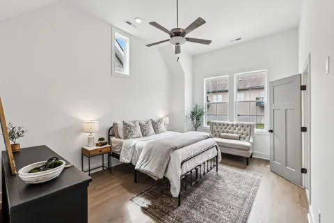 a bedroom with bed and a window