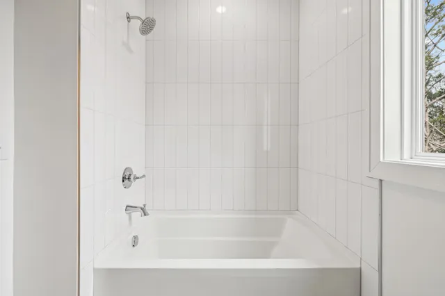 a close up of a bathtub curtain