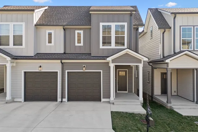 a front view of a house with a garage