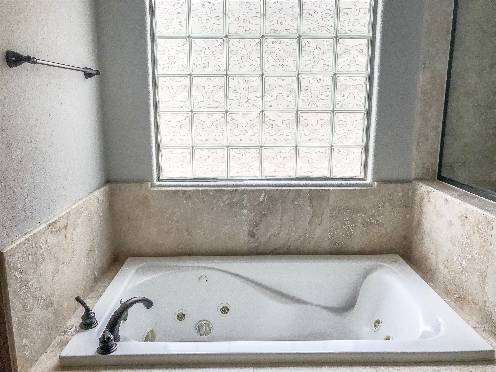 1432 West 21st Street, Unit F Houston, TX 77008 - Photo 16 of 27 a white bath tub sitting in a bathroom next to a window