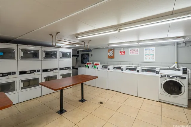 a kitchen with a stove a sink and a refrigerator