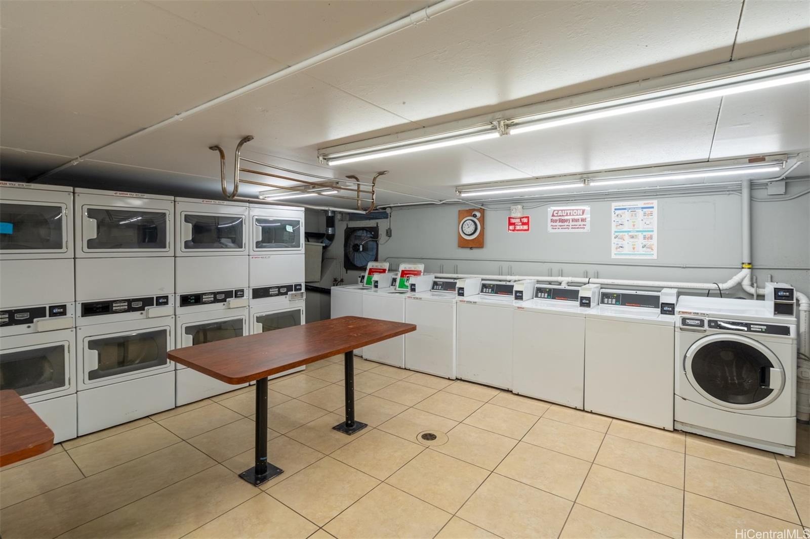 2888 Ala Ilima Street, Unit 611 Honolulu, HI 96818 - Photo 18 of 22 a kitchen with a stove a sink and a refrigerator