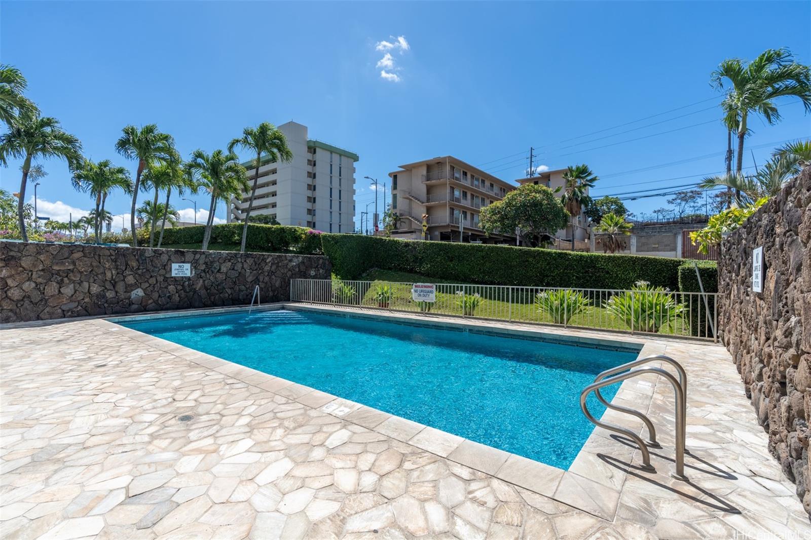 2888 Ala Ilima Street, Unit 611 Honolulu, HI 96818 - Photo 19 of 22 a view of swimming pool from a lounge chair