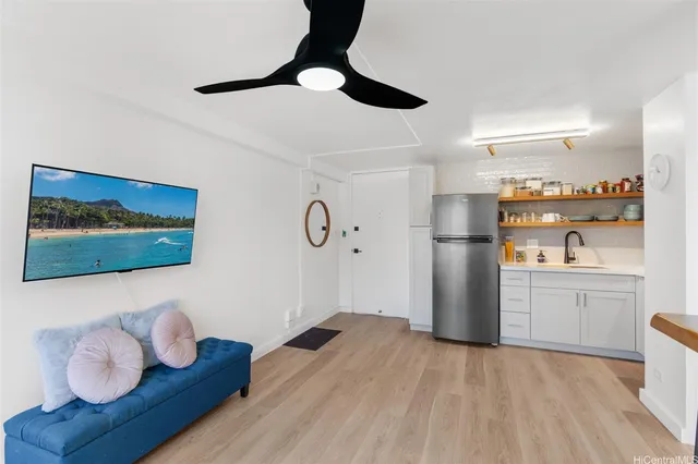 a kitchen with stainless steel appliances a refrigerator and a stove top oven