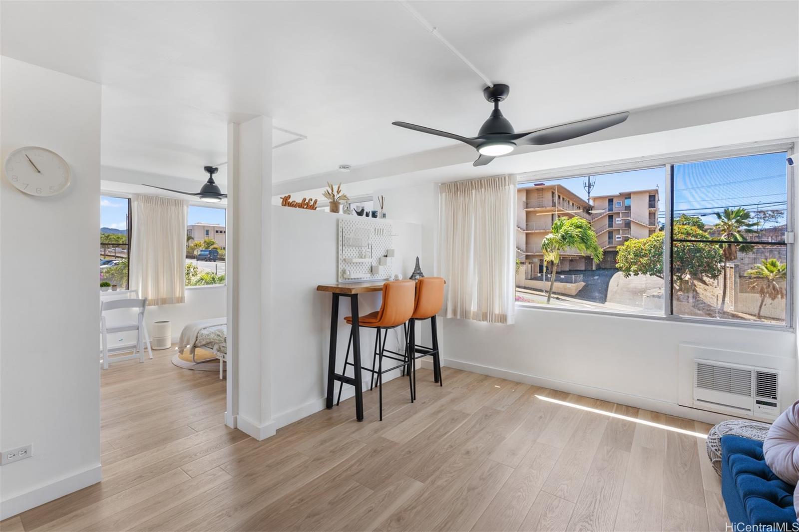 2888 Ala Ilima Street, Unit 611 Honolulu, HI 96818 - Photo 5 of 22 a view of a livingroom with furniture window and wooden floor