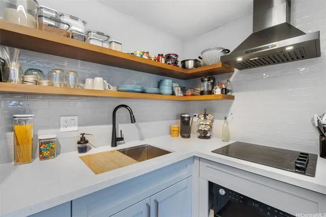 a kitchen with a sink and a stove
