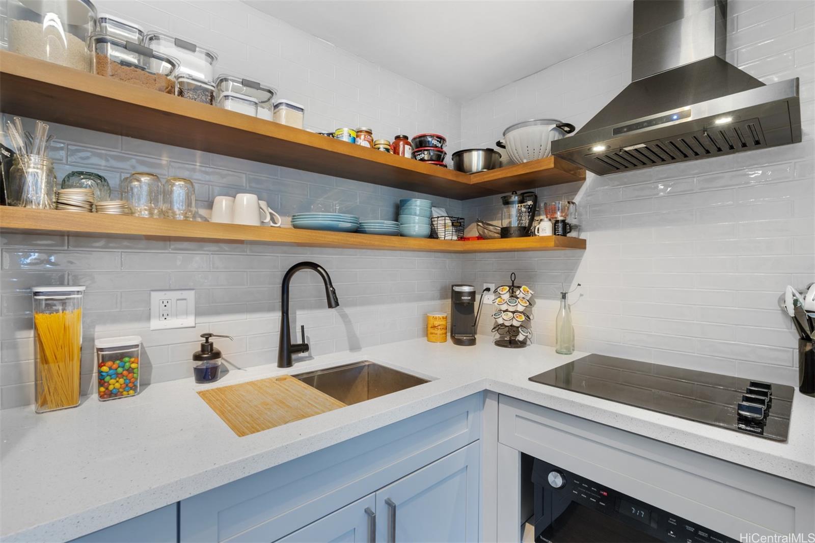 2888 Ala Ilima Street, Unit 611 Honolulu, HI 96818 - Photo 7 of 22 a kitchen with a sink and a stove