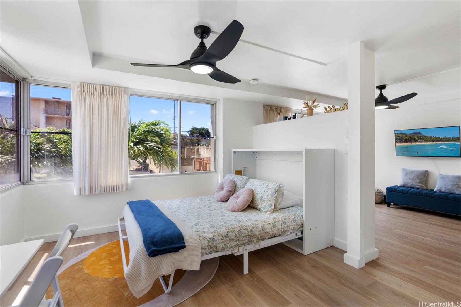 2888 Ala Ilima Street, Unit 611 Honolulu, HI 96818 - Photo 8 of 22 a bedroom with furniture and a large window