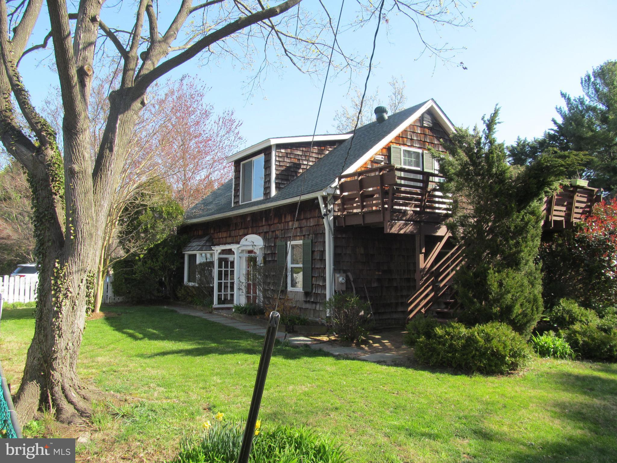 1413 Sharps Point Road Annapolis, MD 21409 - Photo 27 of 29 a front view of a house with a yard