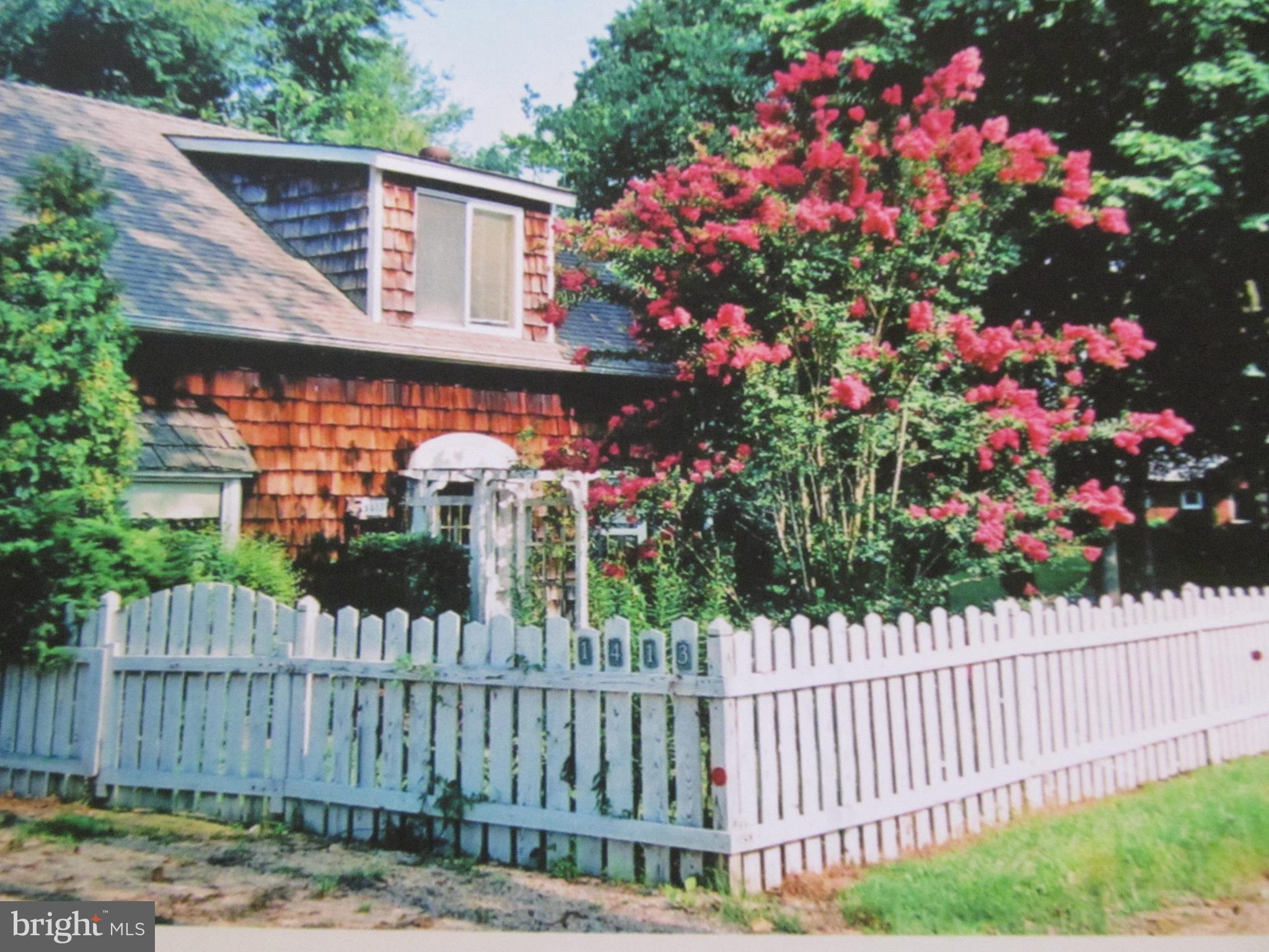 1413 Sharps Point Road Annapolis, MD 21409 - Photo 8 of 29 a view of a house with a small yard and wooden fence