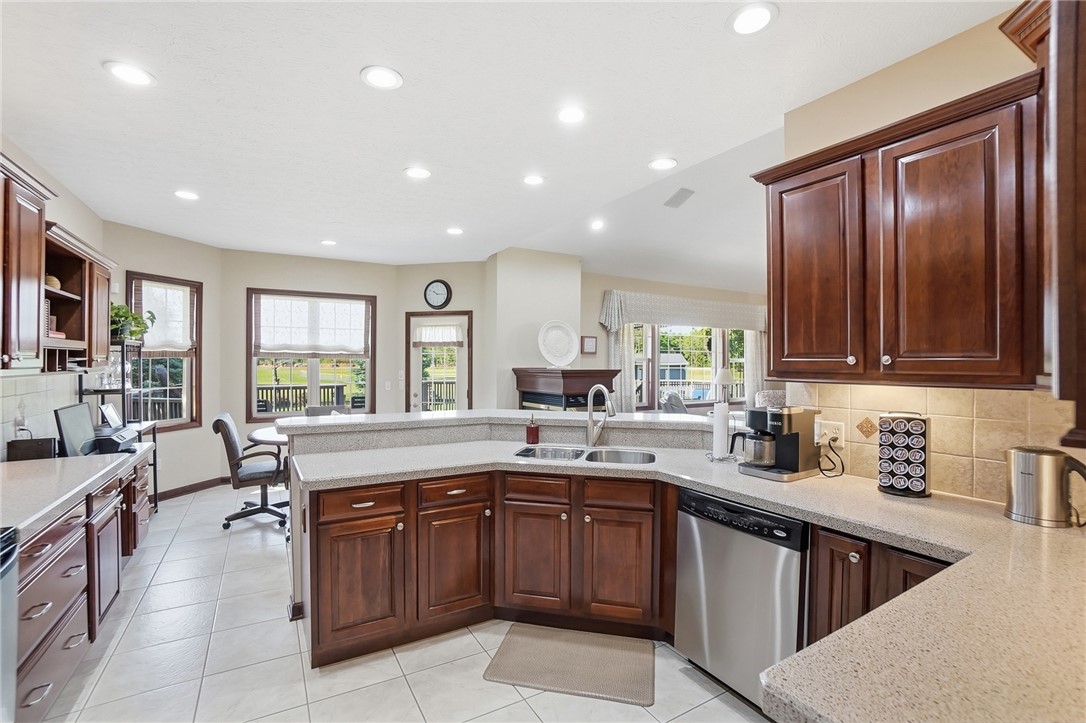 710 Governors Road Troy, OH 45373 - Photo 13 of 56 This kitchen features rich cabinetry, abundant counter space, and integrated appliances, perfect for daily living and entertaining.