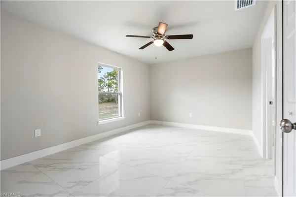 a view of an empty room with a window