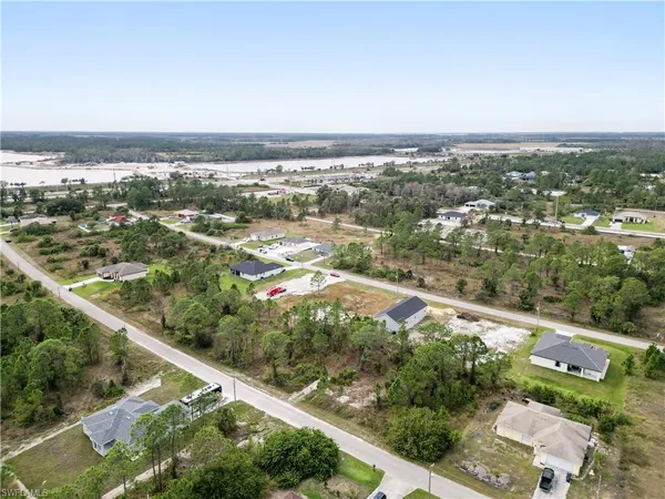 an aerial view of city and lake