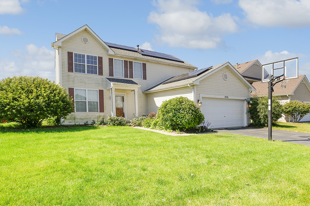 front view of a house with a yard