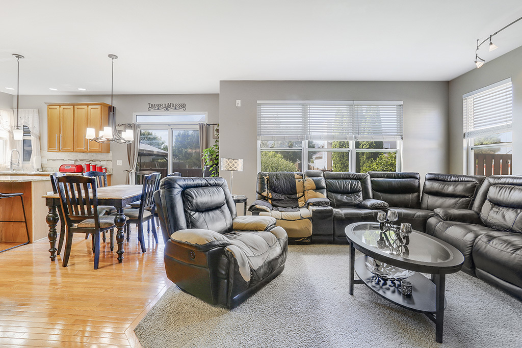 1939 Ashbrooke Road Romeoville, IL 60446 - Photo 5 of 20 a living room with furniture and a large window
