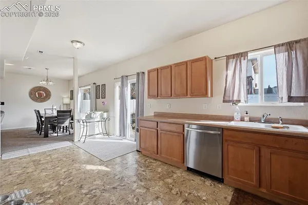 a kitchen with sink and cabinets