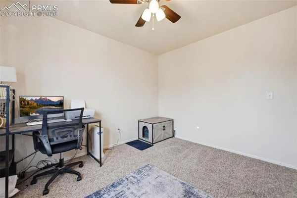 a workspace with furniture and a window