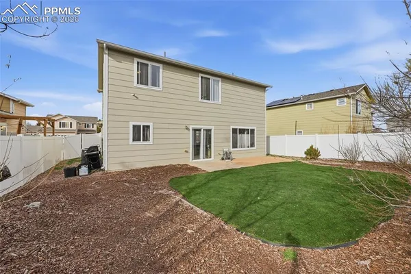 a view of a backyard with a garden and plants