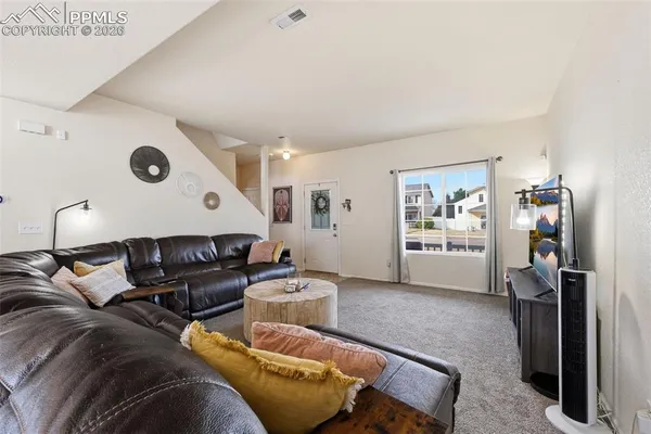 a living room with furniture and a window