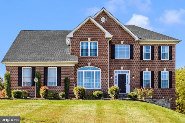 a front view of a house with lots of swimming pool