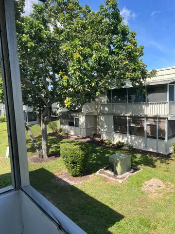 a view of a house with backyard from a tub