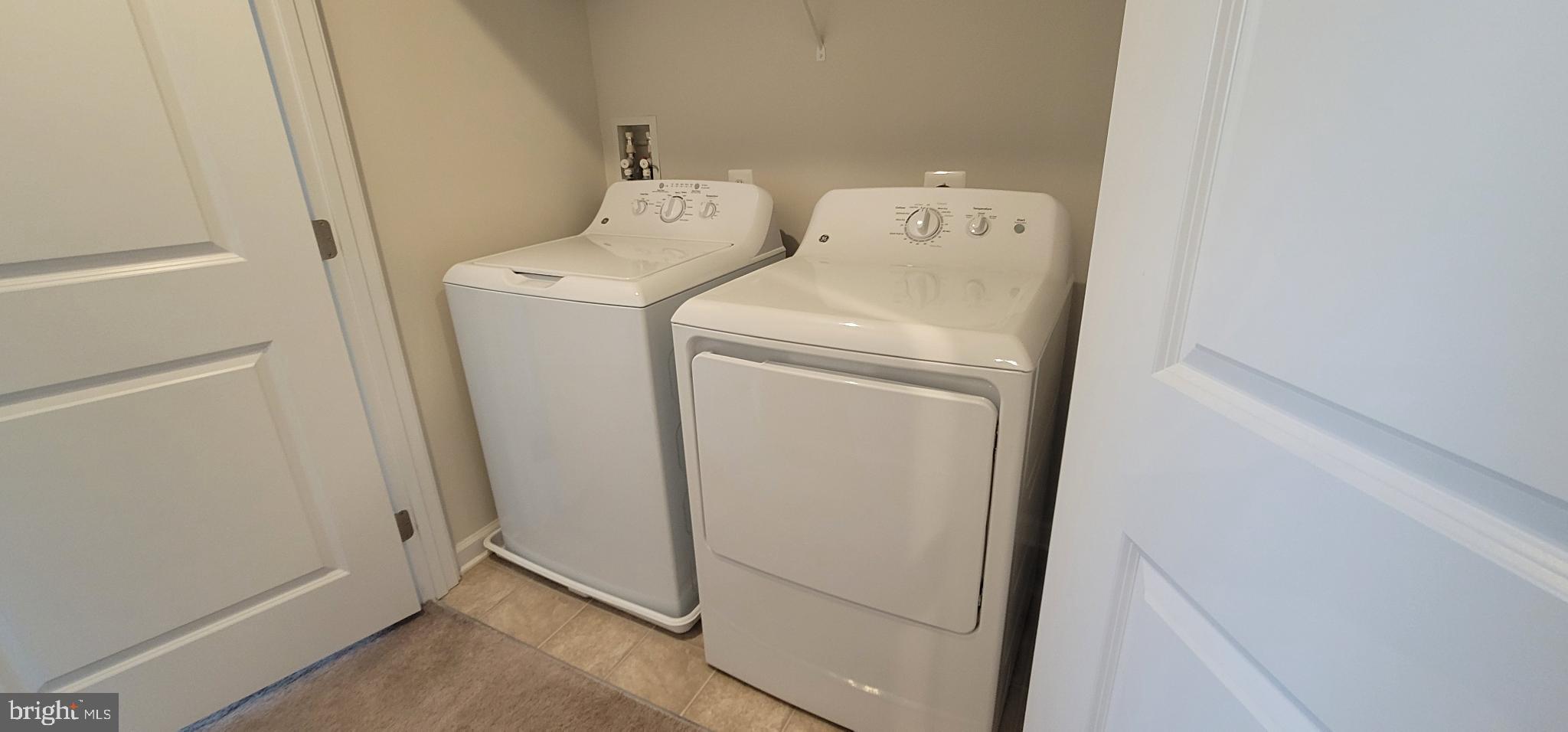 67 Wiggles Court Martinsburg, WV 25403 - Photo 16 of 18 a utility room with dryer and washer