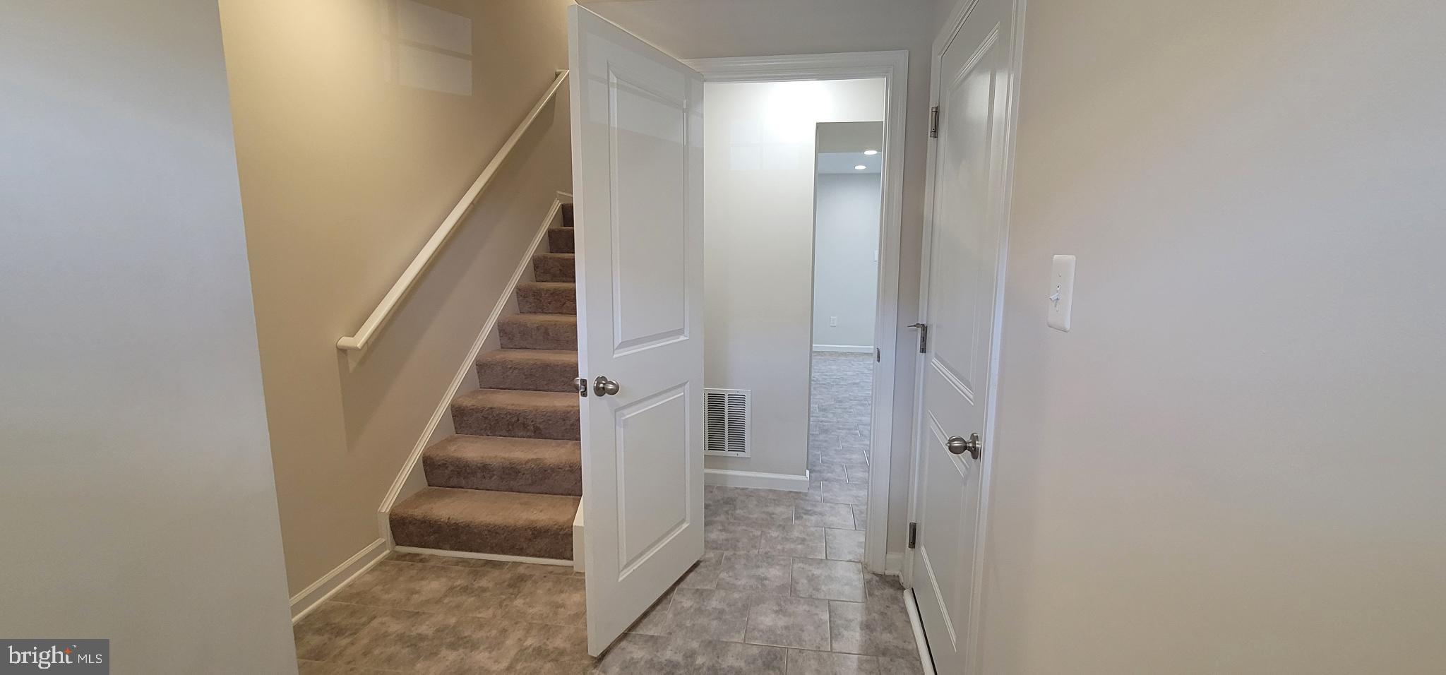67 Wiggles Court Martinsburg, WV 25403 - Photo 3 of 18 a view of staircase with white walls and white door