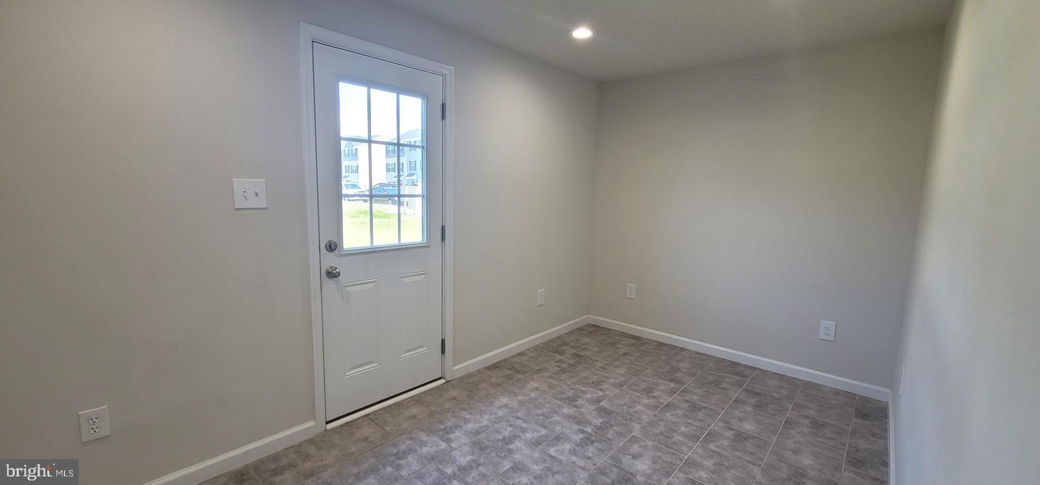 67 Wiggles Court Martinsburg, WV 25403 - Photo 4 of 18 an empty room with windows