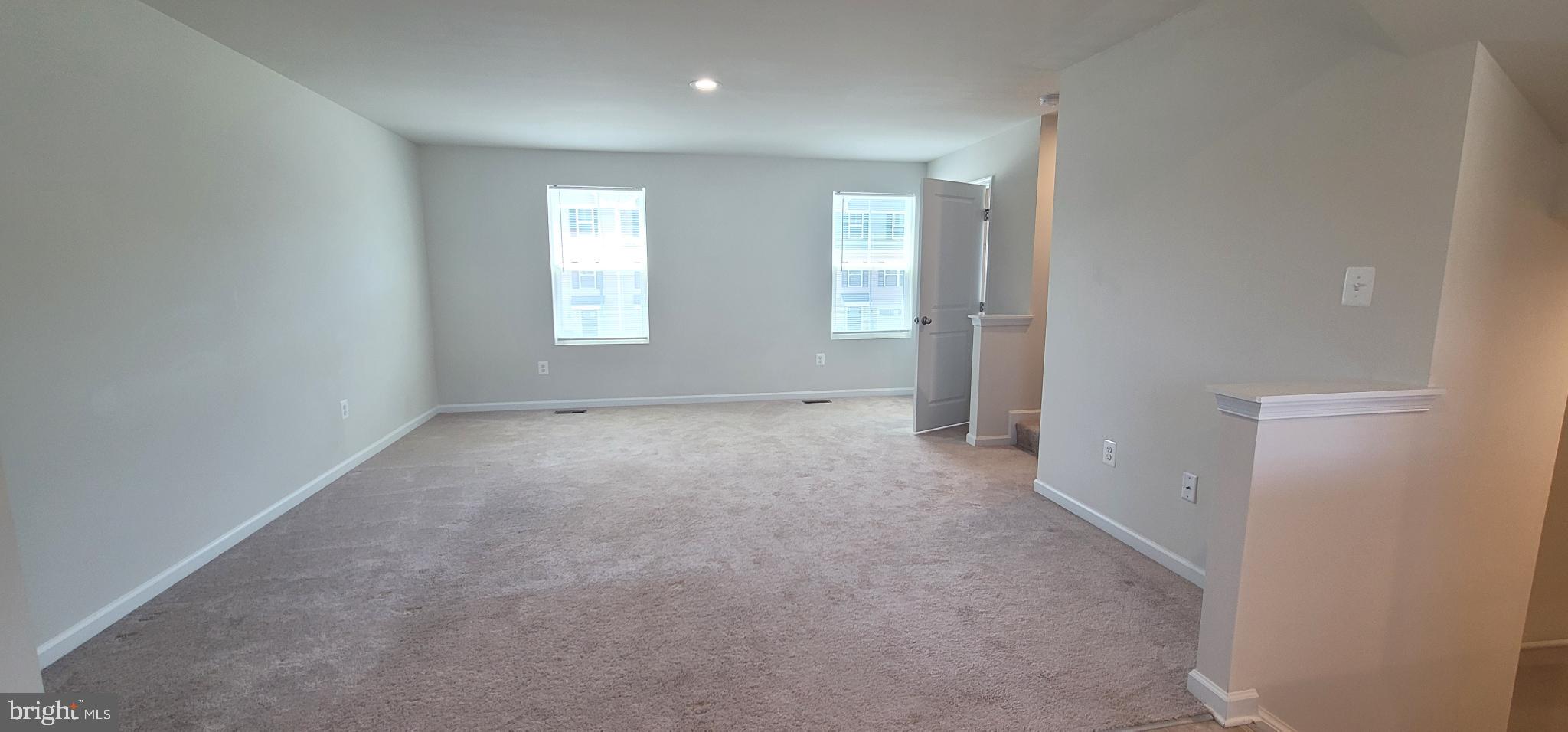 67 Wiggles Court Martinsburg, WV 25403 - Photo 7 of 18 an empty room with windows
