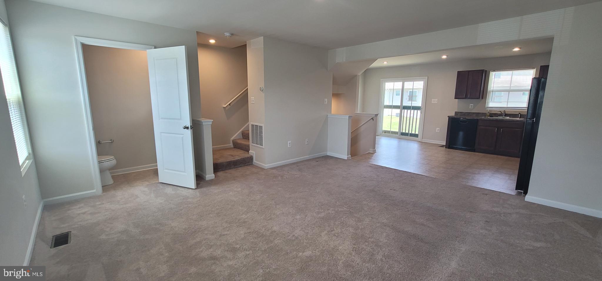67 Wiggles Court Martinsburg, WV 25403 - Photo 8 of 18 a view of empty room with wooden floor and windows