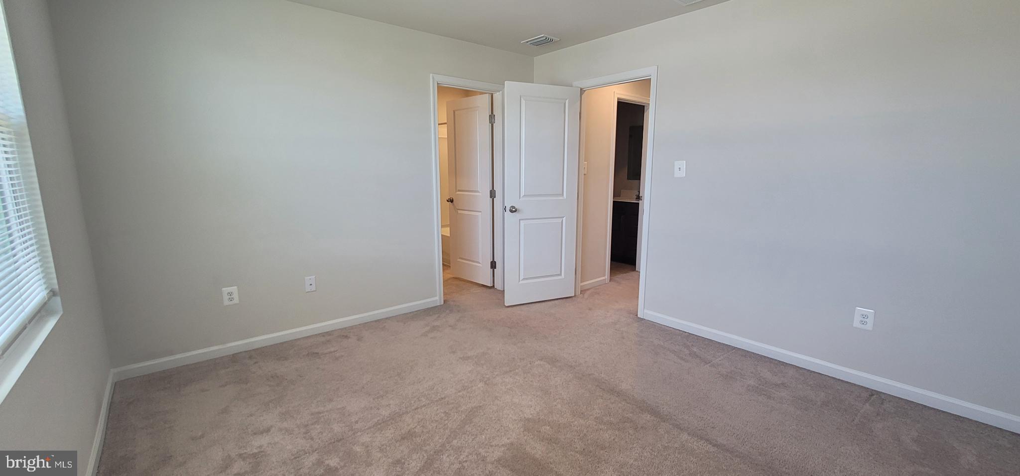 67 Wiggles Court Martinsburg, WV 25403 - Photo 9 of 18 an empty room with windows and closet