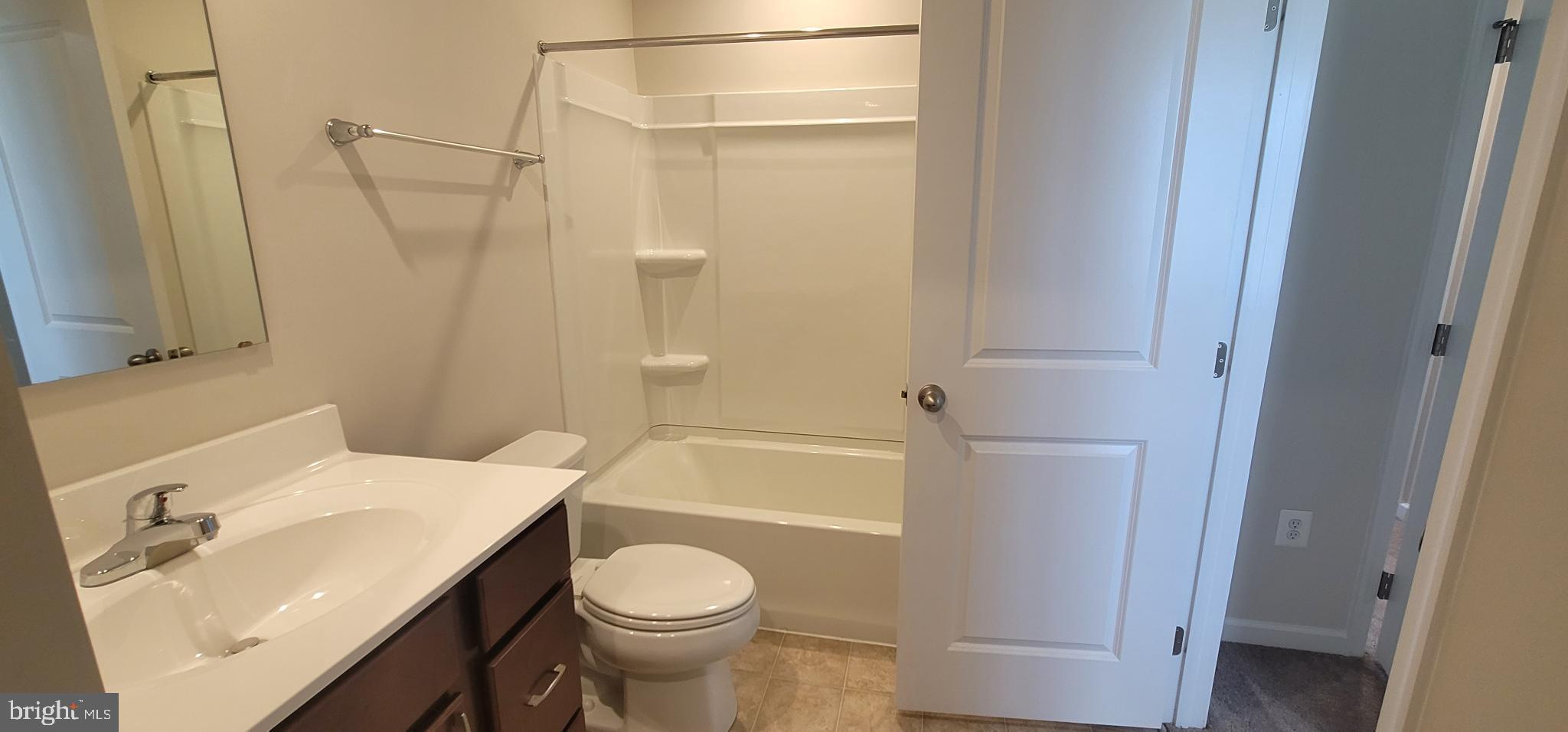 67 Wiggles Court Martinsburg, WV 25403 - Photo 10 of 18 a bathroom with a sink toilet and shower