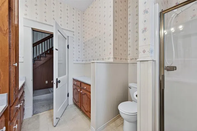 a bathroom with a toilet and a sink