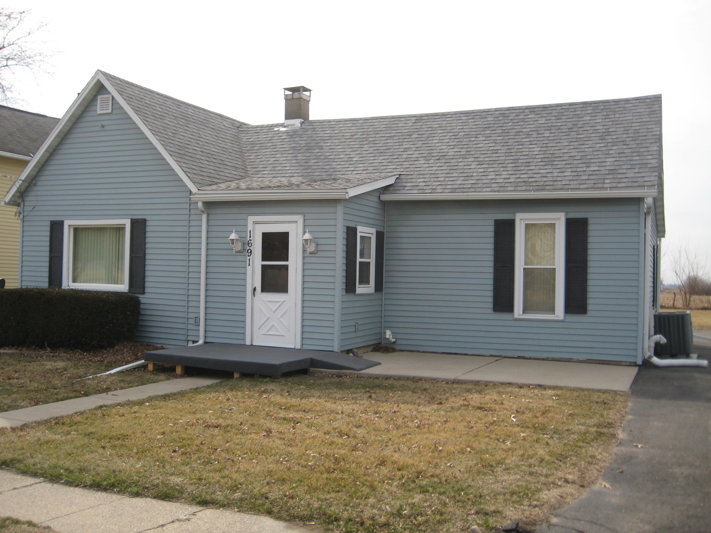 1691 Hoover Road Deer Grove, IL 61243 - Photo 1 of 12 a house view with a backyard