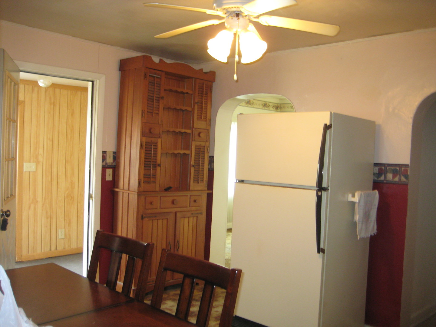 1691 Hoover Road Deer Grove, IL 61243 - Photo 4 of 12 a refrigerator freezer sitting in a kitchen next to a window