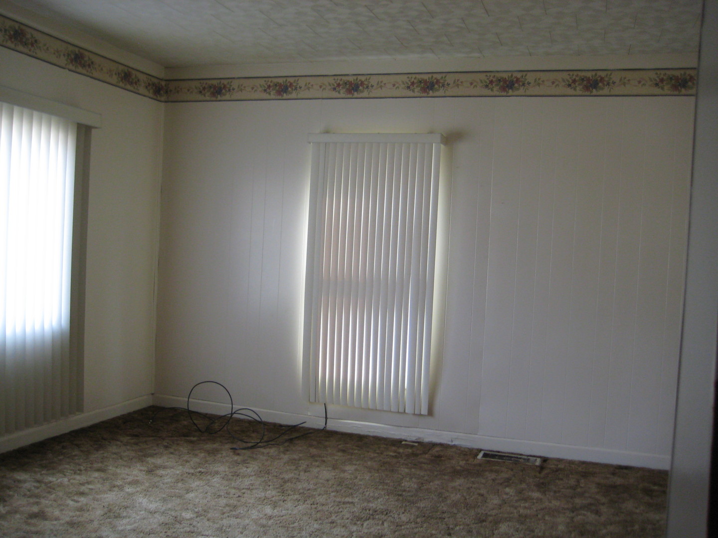 1691 Hoover Road Deer Grove, IL 61243 - Photo 5 of 12 a view of an empty room with a window