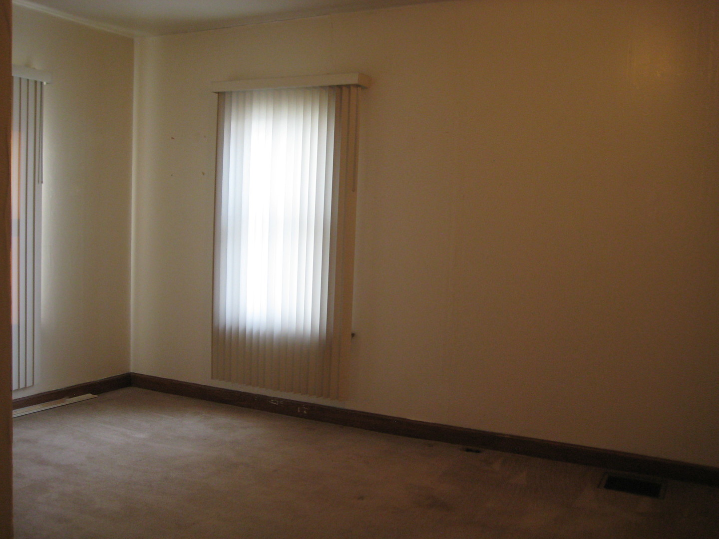 1691 Hoover Road Deer Grove, IL 61243 - Photo 8 of 12 an empty room with a window