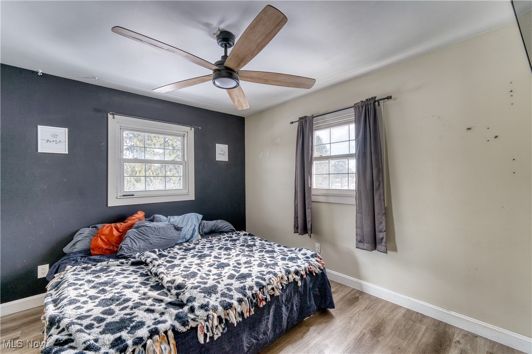 6160 Dresden Road Zanesville, OH 43701 - Photo 14 of 32 Bedroom featuring light wood finished floors and ceiling fan