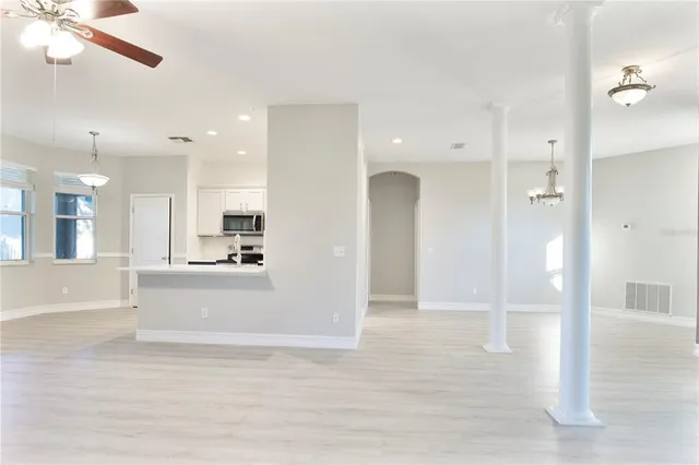 a kitchen with stainless steel appliances granite countertop a refrigerator stove and sink
