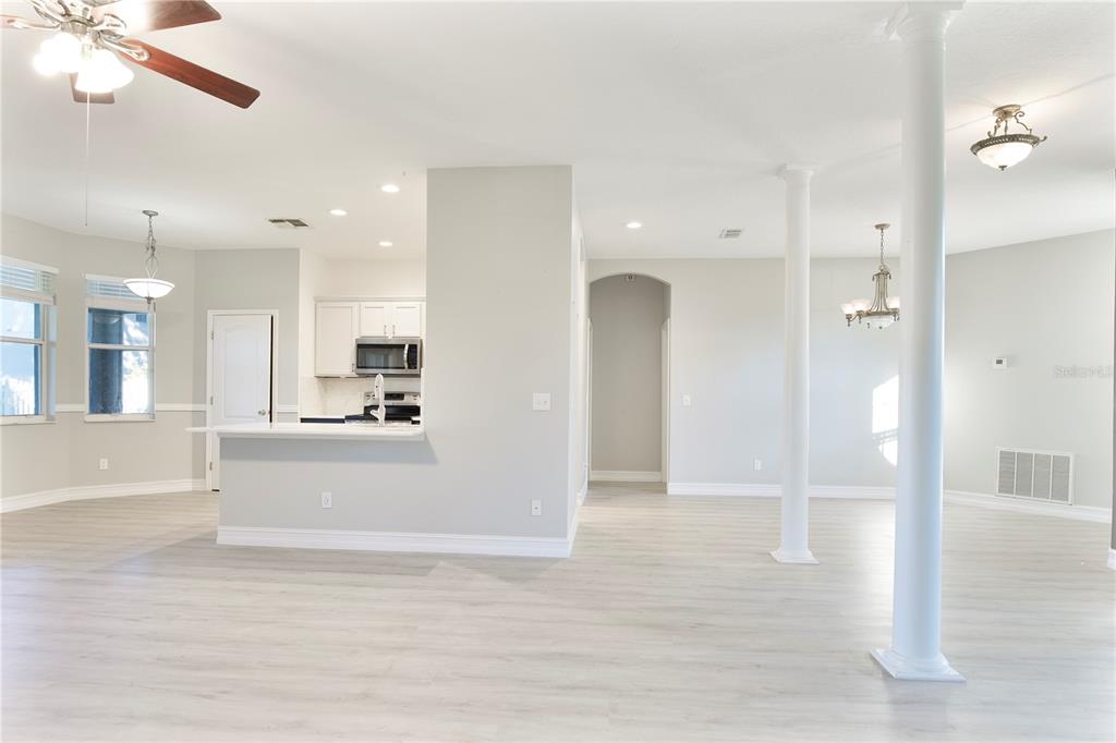 2560 Tall Maple Loop Ocoee, FL 34761 - Photo 12 of 32 a view of a living room and kitchen view