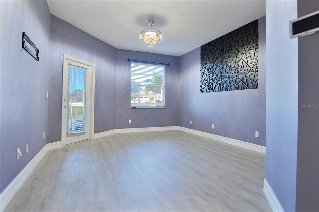 2560 Tall Maple Loop Ocoee, FL 34761 - Photo 21 of 32 a view of an empty room with a window